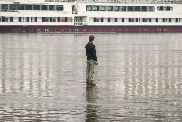 Tomáš Šoltys – Man on the River, 2011, site specific performance, photograph