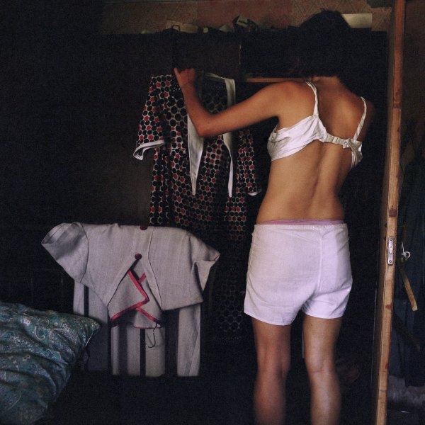 Viktorija Eksta – Changing clothes. Image from the series “God Nature Toil”, 2013 – 2015, scanned color negative, 43 x 43