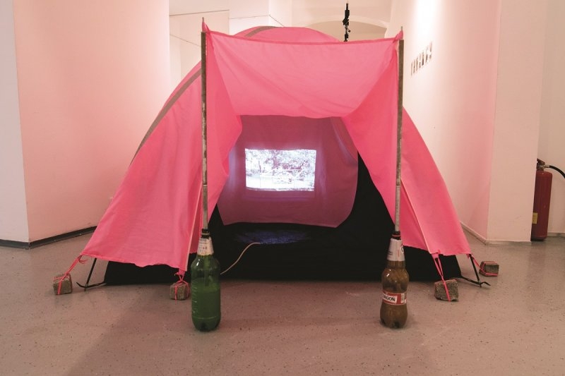 Deana Kolenčíková – Untitled, 2016, tent, plastic bottles, stones, video